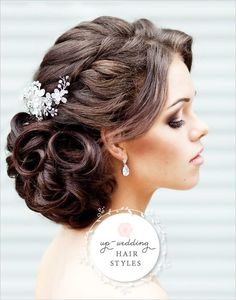 a woman wearing a wedding hair comb with flowers in her hair