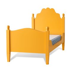 a yellow bed frame with an upholstered mattress