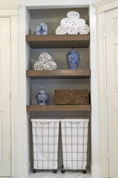 the shelves are filled with blue and white vases, baskets, and other decorative items