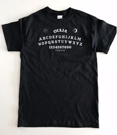 Ouija Board Shirt Halloween Shirt Witch Shirt Ghosts Goth Unisex Halloween T-shirt With Screen Print, Gothic Black T-shirt For Halloween, Black Halloween T-shirt With Text Print, Halloween Cotton T-shirt With Text Print, Unisex Black Grunge Shirt, Unisex Black Graphic Tee Shirt, Black Unisex Grunge Shirt, Black Cotton Grunge Shirt, Unisex Halloween T-shirt