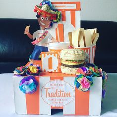 an orange and white box with food on it