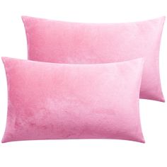 two pink pillows sitting next to each other