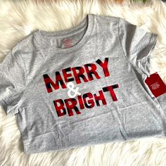 a t - shirt that says merry and bright on it with a red tag in the middle