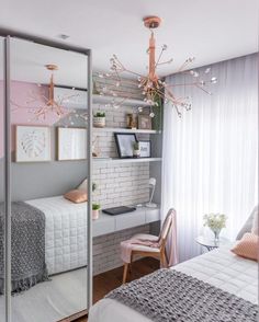 a bedroom with white brick walls, pink accents and a mirrored wall in the corner