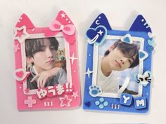 two small frames with cats and hearts on them, one is pink and the other is blue