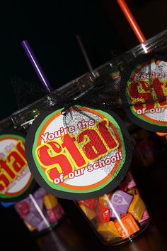 several jars filled with different flavored candies