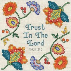 a cross stitch pattern with flowers and the words trust in the lord written on it