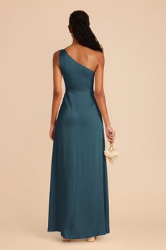 the back of a bridesmaid's dress in teal blue