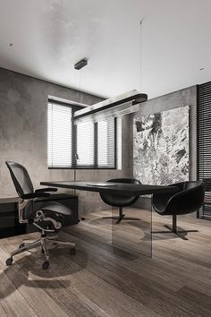 an office with a desk, chair and large painting on the wall in it's center