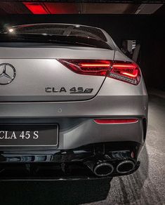 the rear end of a silver mercedes cla 45 s