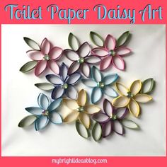 some paper flowers with pearls on them and the words tattle paper daisy art above it