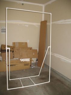 boxes are stacked up in an empty room