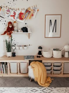 a living room filled with furniture and lots of books on top of a wooden shelf