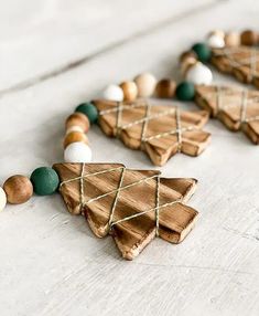 wooden christmas tree ornaments with green and white beads