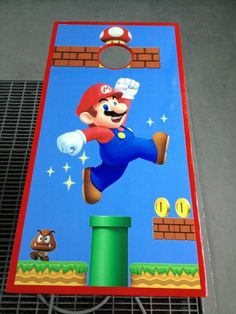 a nintendo wii game being played on a metal grate with an image of mario running through the air