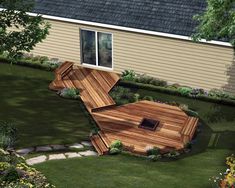 an aerial view of a wooden deck in a backyard with trees and flowers around it