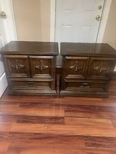 two wooden dressers sitting on top of a hard wood floor