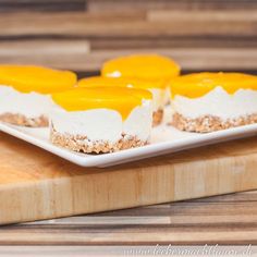 small desserts are arranged on a cutting board