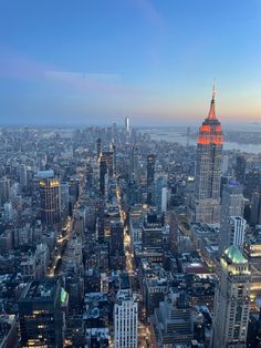 an aerial view of new york city at night from the top of the empire building