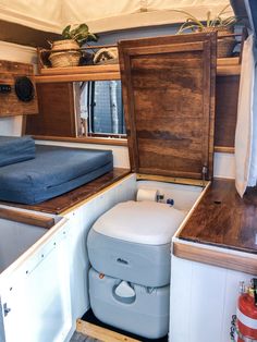 the inside of a small bathroom with a toilet and sink