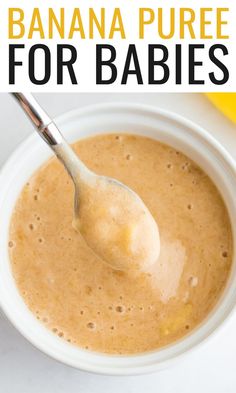 banana puree for babies in a white bowl with a spoon