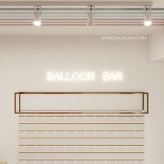 an empty bar with lights above it and the word balloon bar written on the wall