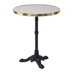 a black and gold side table with a white marble top on an ornate pedestal, isolated against a white background