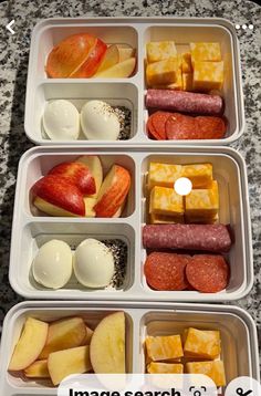 three plastic containers filled with different types of fruit and meats next to each other