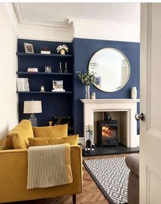 a living room with blue walls and a fireplace