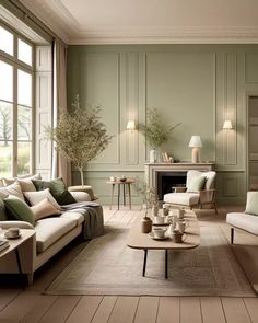 a living room filled with furniture and green walls