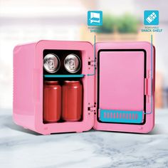 an open pink lunchbox with two cans in it and instructions on how to use the door