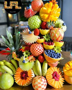 an arrangement of fruit is displayed on a table