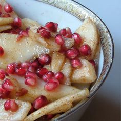 pomegranates are mixed into the food in this bowl