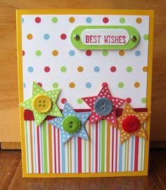 a handmade card with buttons and stars on the front, which says best wishes