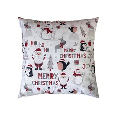 a white pillow with santa claus and other christmas items printed on the front, sitting on a white background