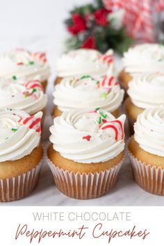 white chocolate peppermint cupcakes with frosting and candy canes