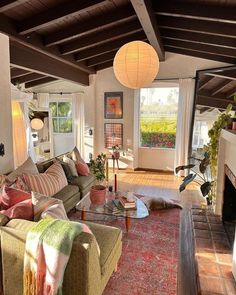 a living room filled with furniture and a fire place