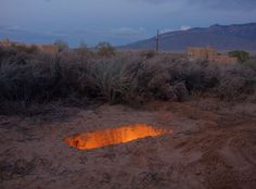 a fire pit in the middle of a desert