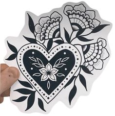 a heart shaped sticker with flowers on it