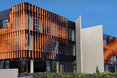 an orange and black building with many windows