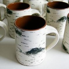 a group of coffee mugs sitting next to each other