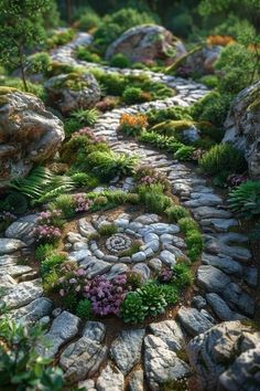 a garden with rocks, plants and flowers on the ground in front of it is an image of a stone path surrounded by greenery