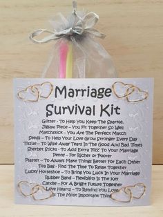 a marriage survival kit with two hearts on it and a ribbon tied around the top