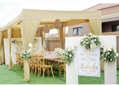 an outdoor wedding venue with tables and chairs set up for the guests to sit at