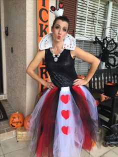 a woman dressed up as a queen of hearts