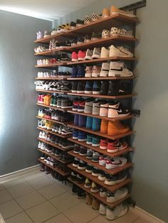 a large shoe rack with many pairs of shoes on it