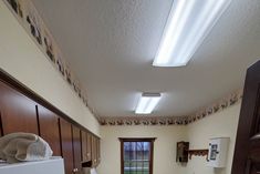 a kitchen with white appliances and wooden cabinets