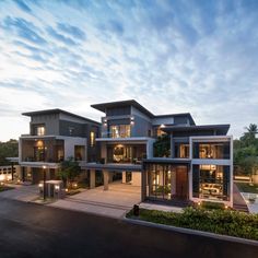 an exterior view of a modern house at dusk