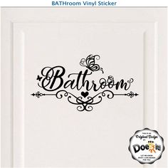 bathroom door sticker with the word bathroom in black and white lettering, on top of a