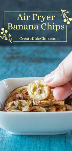 air fryer banana chips in a white bowl on a blue table with text overlay